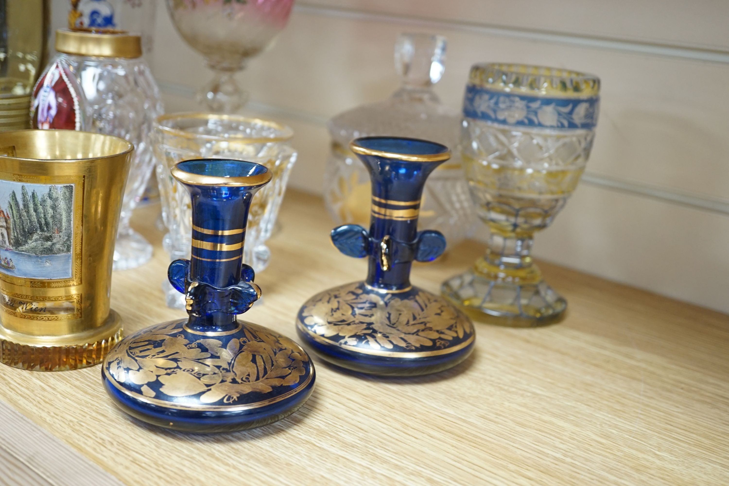 A wheel engraved Bohemian blue and yellow glass goblet, a similar gilded beaker in the manner of Anton Kothgasser, other bohemian cut glass, Moser, an 18th century Dutch soda glass, etc
